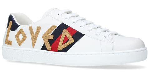 Gucci: White Embroidered 'Loved' New Ace Sneakers 